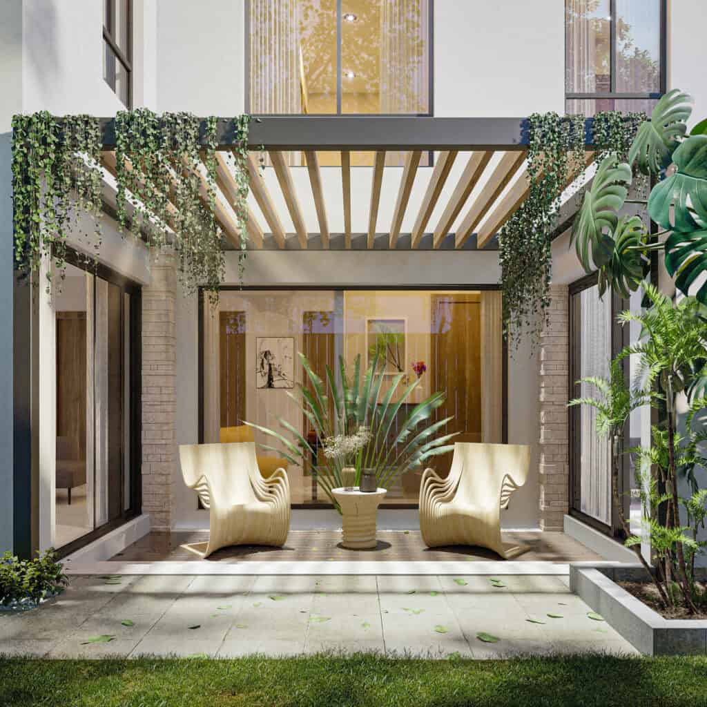 Contemporary courtyard design by Nexa Homes Australia featuring sculptural timber chairs, lush greenery, and a sleek pergola—showcasing seamless indoor-outdoor living in a custom-built home.